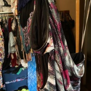 Multicolored tank top. Open to one shoulder.